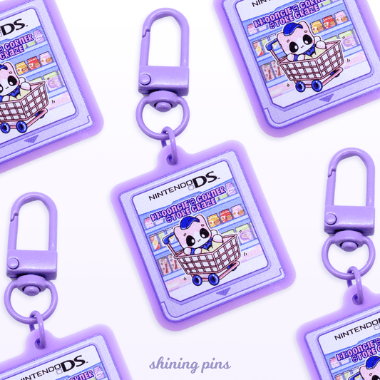 'Kkoongie's Corner Store Craze' Game Cartridge Keychain